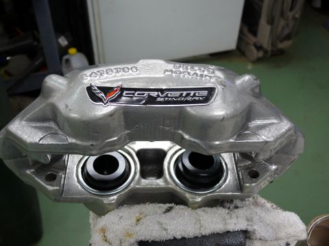 Silver Corvette Stingray brake caliper with "CORVETTE STINGRAY" badge