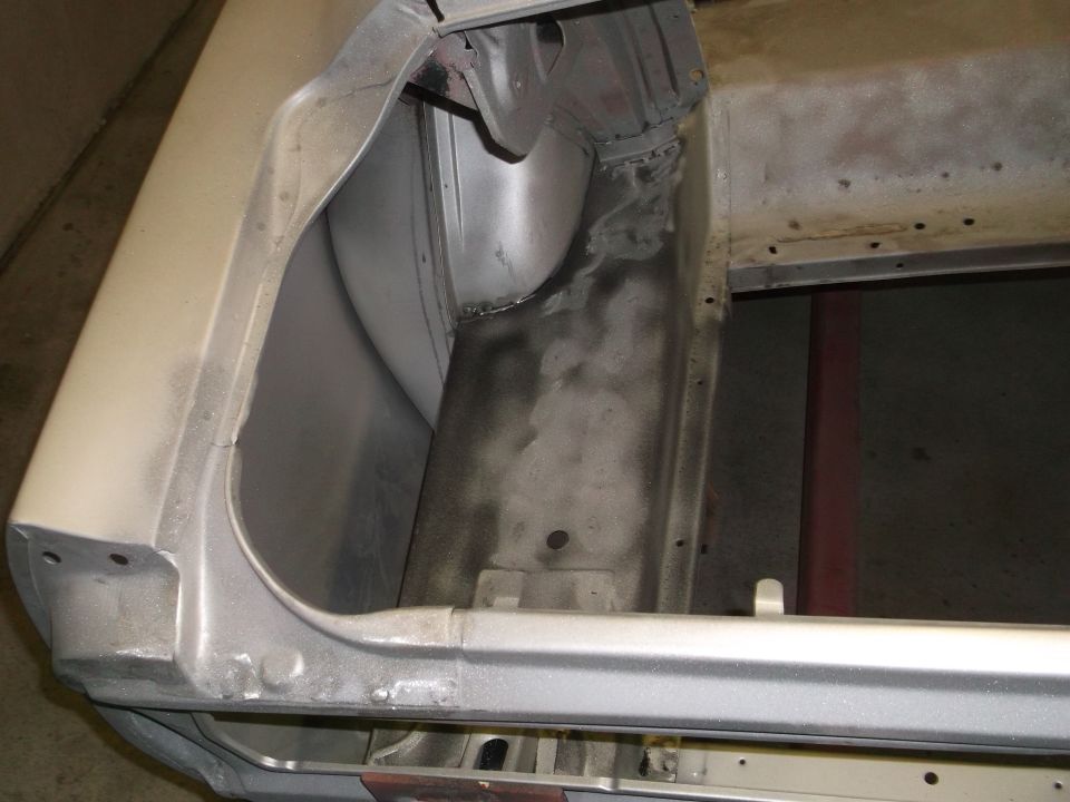 Silver 1967 Ford Mustang trunk interior showing metalwork and primer