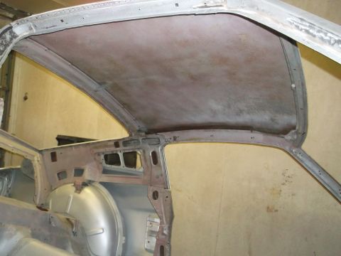 1967 Ford Mustang - The interior of a car is shown, focusing on the bare metal roof structure and headliner supports.