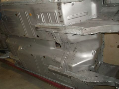 1967 Ford Mustang - Underbody of a 1967 Ford Mustang, showing the bare metal chassis and floor pans.