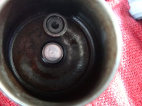 1993 Ford Taurus - Engine valve seats are visible inside a metal component, possibly a cylinder head.