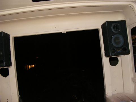 Interior speakers mounted above rear window opening