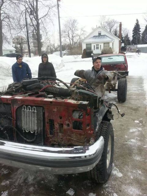 1995 Ford F-150 - This 1995 Ford F-150 chassis is missing its front end and is being towed in the snow.