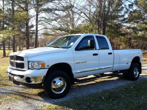 1967 Ford Mustang - White 2003 Dodge Ram 3500 dually pickup truck.