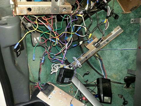 2007 Dodge Durango - The vehicle's interior shows a complex and tangled wiring harness, likely for the dashboard or under-seat components.