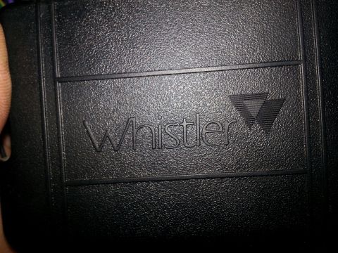 2007 Dodge Durango - Embossed Whistler logo on a black electronic device, likely a radar detector.