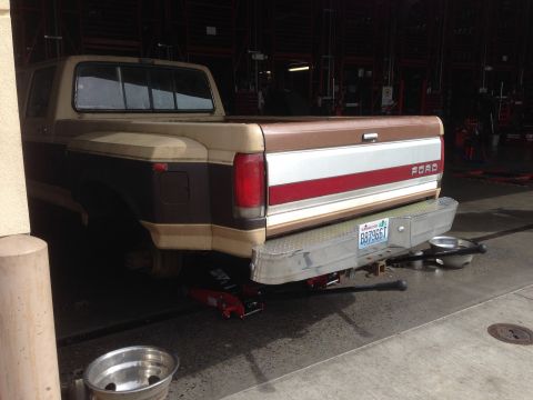 1988 Ford F-350 - This 1987 Ford F-350 pickup truck is being worked on, with jacks visible under the rear axle.