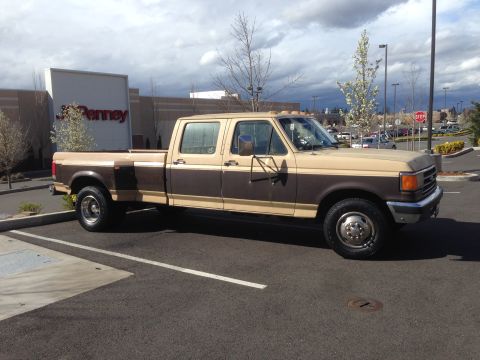1988 Ford F-350 - This two-tone Ford F-350 crew cab dually is parked in a lot with a JCPenney store in the background.