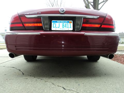 2004 Mercury Grand Marquis - Rear view of a maroon Mercury Grand Marquis with a Michigan license plate.