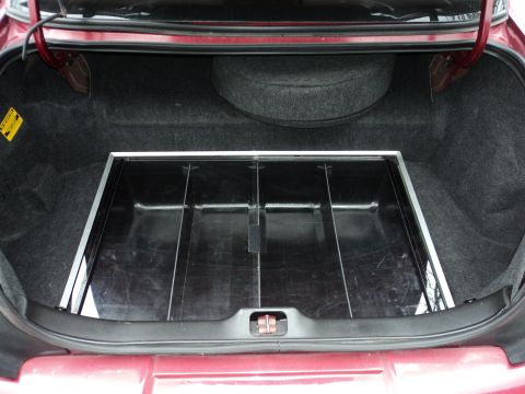 2004 Mercury Grand Marquis - The trunk of a 2004 Mercury Grand Marquis shows a spare tire and a custom organizer tray.