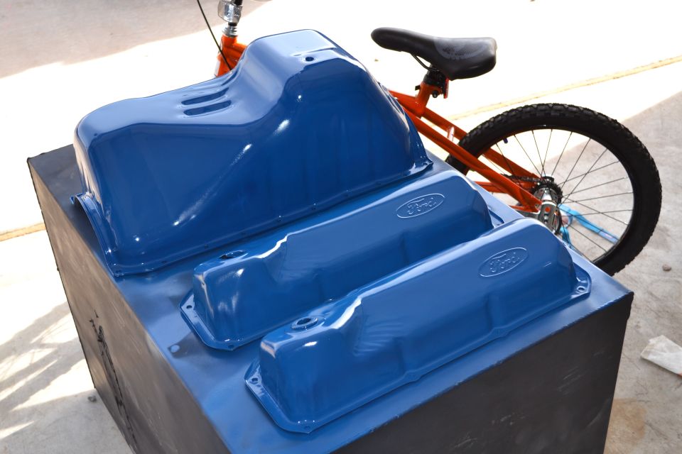 Blue Ford valve covers and oil pan with visible Ford logos