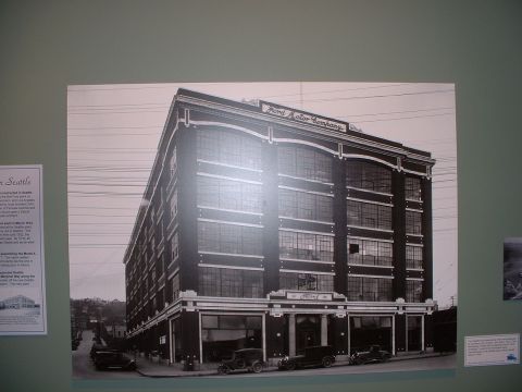 1999 Ford Crown Victoria - Historic Ford Motor Company building in Seattle, likely from the early 20th century.