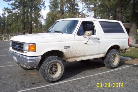 1990 Ford Bronco - This white Ford Bronco appears to be from the early 1990s, not 1990 as claimed.