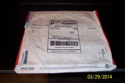 1990 Ford Bronco - A USPS Priority Mail package is shown with a tracking label and postage details.