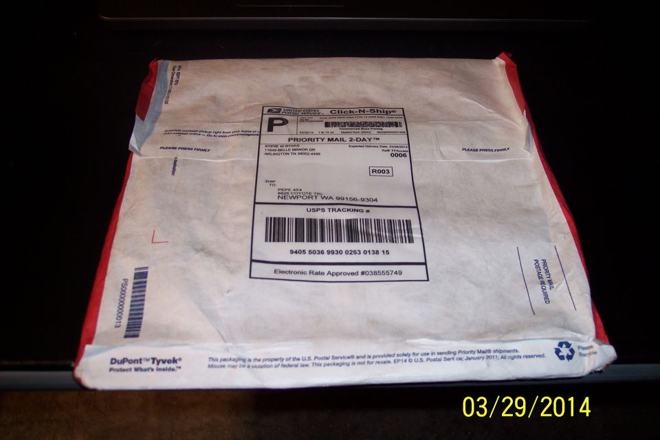 USPS Priority Mail package with tracking label