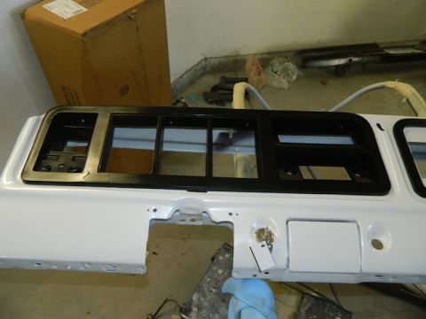1979 Ford Bronco - White Ford Bronco tailgate panel with black trim around window openings and a lock cylinder.