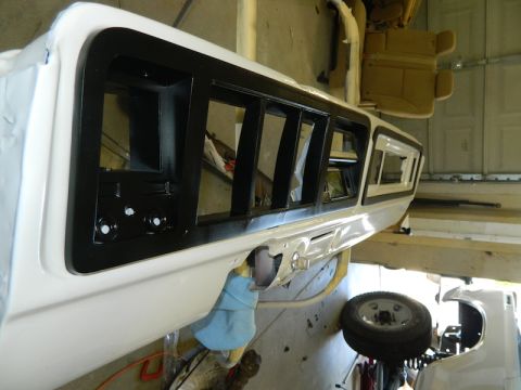 1979 Ford Bronco - Close-up of a vehicle's interior panel, possibly from the late 1970s, showing parts during a restoration project.