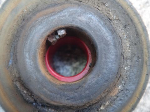 1993 Ford Taurus - Close-up of a damaged strut mount, showing signs of wear and rust.