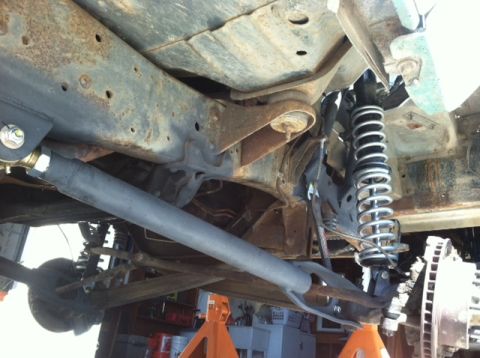 1977 Ford F-350 - Undercarriage view shows front suspension components including coilovers and a drive shaft.