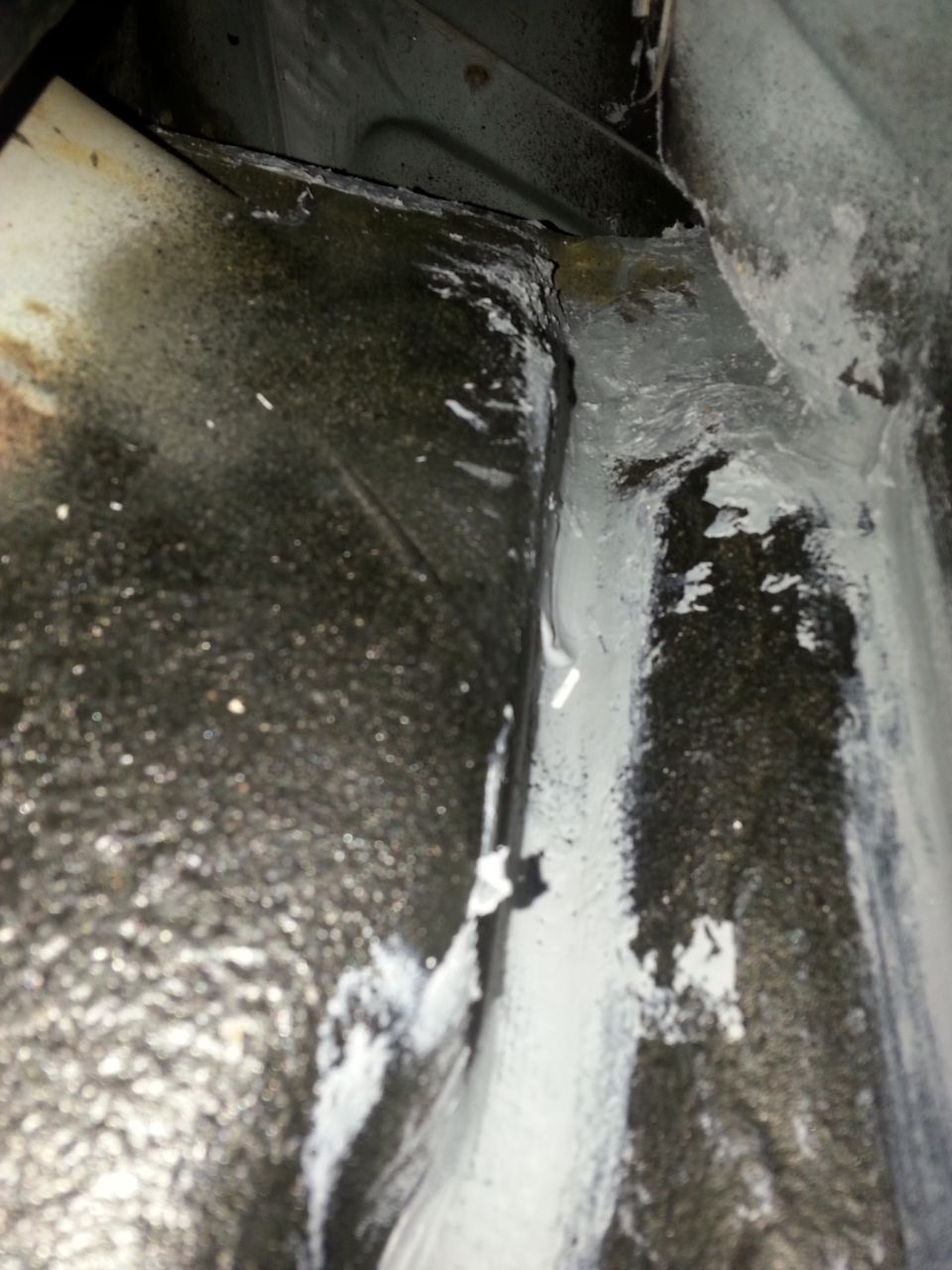 I used a tube of the Dyantron seam sealer to try and address the leak..my assumption was that it was still coming from the trough..even using a hose I couldn't get it to leak, it would only do it after it rained.