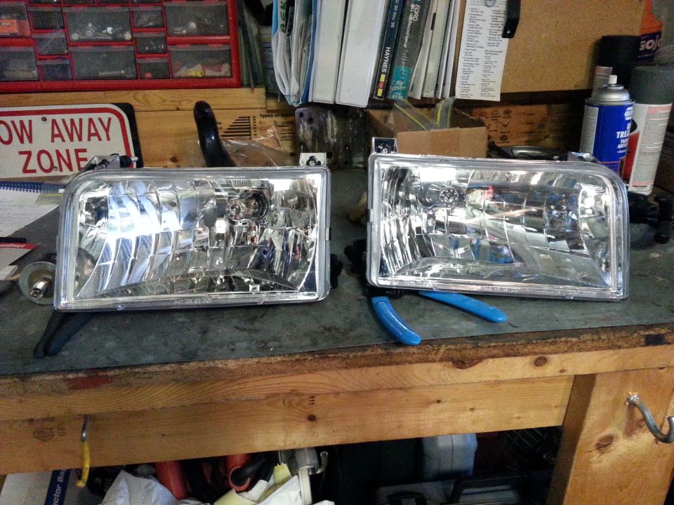 Matrix Diamond-Style Headlamps 09-1010 from summit racing, $130. They're not the fanciest, but I looked at a couple of the projector assemblies and didn't want to spend twice the $$.