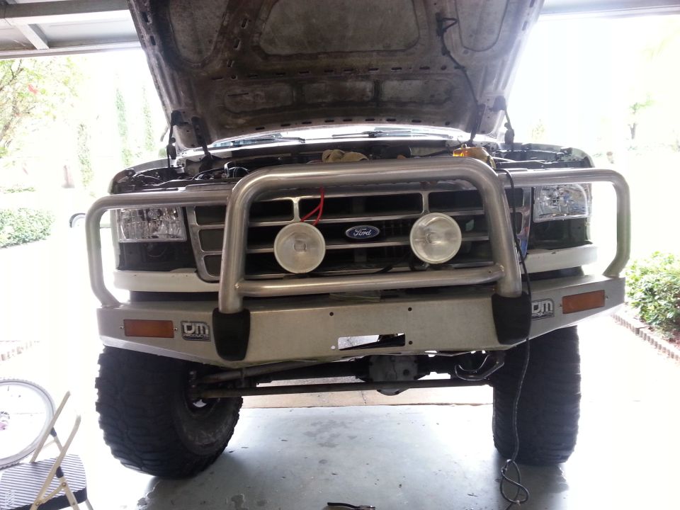 1992 Ford Bronco front view with brush guard and open hood
