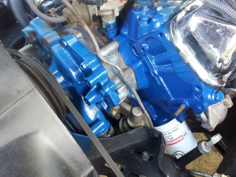 1976 Ford Ranchero - Engine components painted blue, including a Motorcraft oil filter, are visible in this close-up shot.