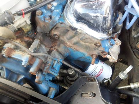 1976 Ford Ranchero - Close-up view of an engine component, showing a Motorcraft oil filter attached to the engine block.