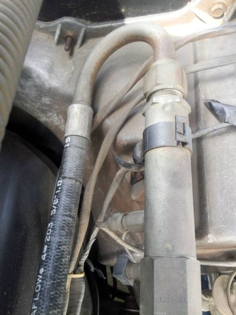 1976 Ford Ranchero - Close-up view of an engine bay air conditioning hose, showing part number and size information.