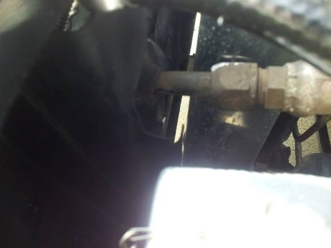 1976 Ford Ranchero - A close-up view of a metal line and fitting, likely from a vehicle's air conditioning system.