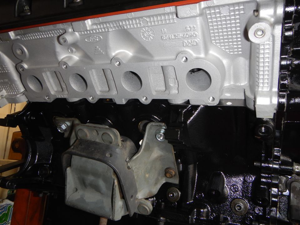 Close-up of cast aluminum intake manifold ports with cast lettering