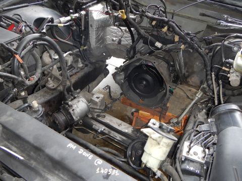 2003 Ford Crown Victoria - engine bay during teardown with the transmission bellhousing visible and a handwritten note reading 'PM Done @ 140531'.