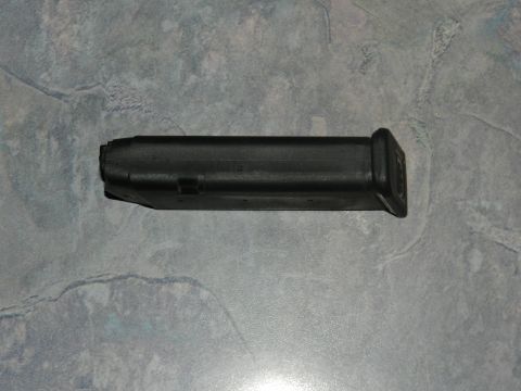 1996 Ford Bronco - A black gun magazine is shown against a textured background.