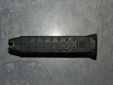 1996 Ford Bronco - A black Glock magazine is shown with round count indicators and manufacturer information.