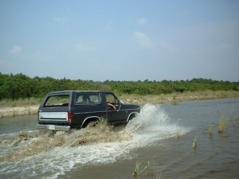 1985 Ford Bronco - This 1985 Ford Bronco is shown driving through a body of water.