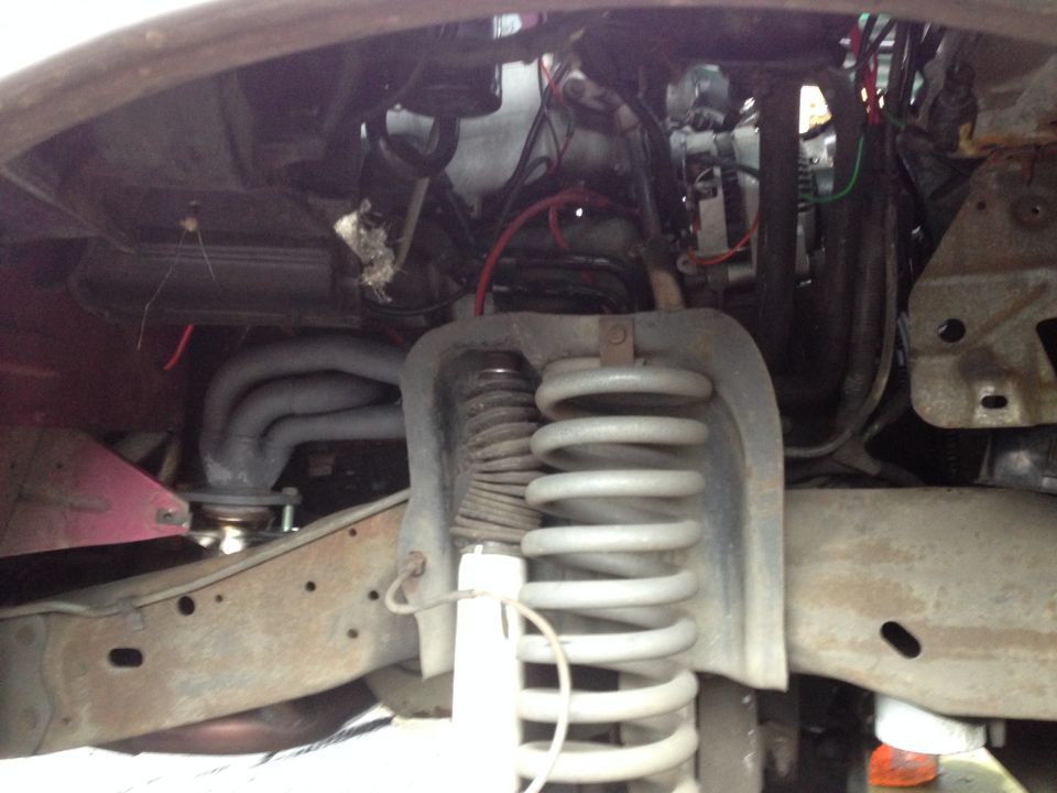 Here is the passenger side before. I got the wheel and wheelwell out in about 5 minutes. This is a muct for anyone doing headers.