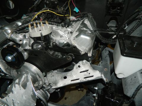 1979 Ford Bronco - Close-up view of an engine bay, showing the distributor cap, wiring, and various engine components.