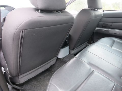 2001 Ford Crown Victoria - Interior view of the rear passenger area of a 2001 Ford Crown Victoria, highlighting the seating arrangement.