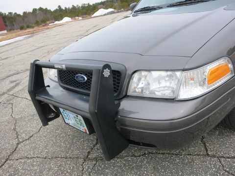 2001 Ford Crown Victoria - Front view of a gray 2001 Ford Crown Victoria equipped with a push bar and displaying license plate 631 636.