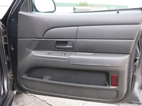 2001 Ford Crown Victoria - Interior view of the driver's side door panel on a 2001 Ford Crown Victoria.