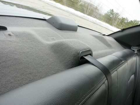 2001 Ford Crown Victoria - Interior view of a car's rear seat and deck, with a seatbelt visible.