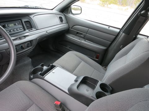 2001 Ford Crown Victoria - Interior view of a 2001 Ford Crown Victoria, highlighting the front seating area and dashboard controls.