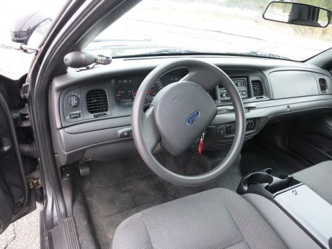 2001 Ford Crown Victoria - The interior of a 2001 Ford Crown Victoria, the driver's side dashboard and steering wheel.