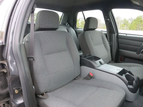 2001 Ford Crown Victoria - Interior view of the front seats and center console of a 2001 Ford Crown Victoria.