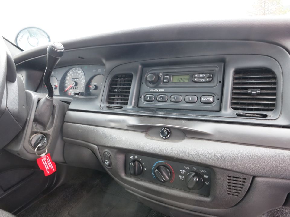 2001 Ford Crown Victoria interior dashboard with radio and gauges
