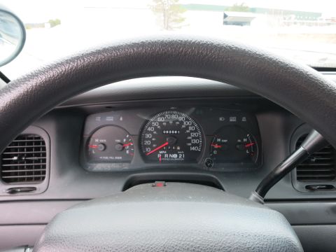 2001 Ford Crown Victoria - Interior view of a 2001 Ford Crown Victoria, the dashboard gauges and steering wheel.