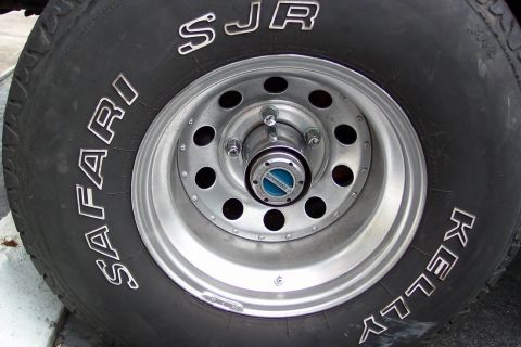 1986 Ford Bronco - Cleaned the rust and a quick paint with laquer and with a clear coat. and new lugnuts and center caps. Also got ride of those crappy auto h…