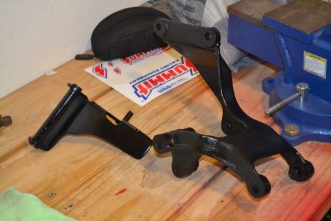 1981 Ford F-250 - Painted suspension parts sit on a workbench with a vise in the background.