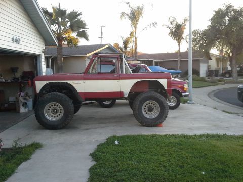 1968 Ford Bronco - This modified 1968 Ford Bronco features a two-tone paint scheme and significant suspension lift.