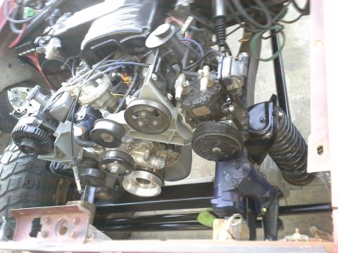 1968 Ford Bronco - The complex V-belt system of an engine is shown in this close-up view.